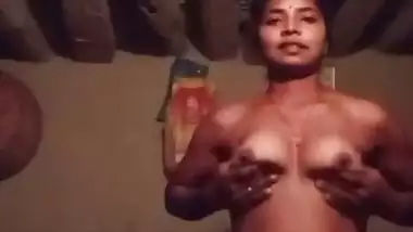 Village girl stripping and playing with bouncing boobs