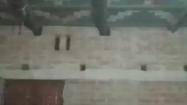 Village girl applying lotion to full nude body