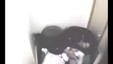 Sexy dark skin Indian girl hiking her blouse to...