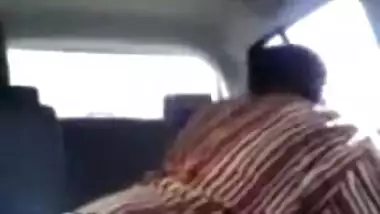 Tamil guy smooching and pressing boobs of cute girl in car