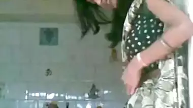 Hindu couple worshipping Shiva Lingam inside Temple 