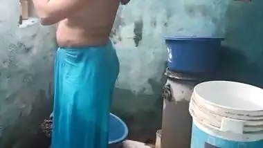 Mature topless village aunty bathing caught on cam
